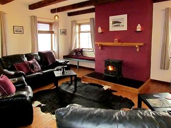 The comfortable sitting room with solid fuel stove